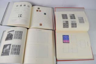 Three stamp albums containing mint commemorative stamps, Penny black, Definitives, Penny reds and