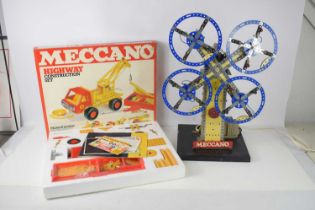 A vintage Meccano shop display model of windmill, in blue and yellow with lights and electric motor,