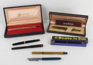 A collection of vintage fountain pens comprising of a Swan pen with 14ct gold nib, Watermans with