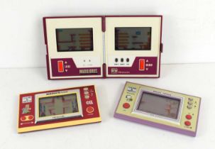 A group of three Nintendo Game and Watch hand held consoles, comprising Mario Bros Multi Screen,