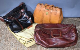 Two Italian leather holdalls together with an Alexander Julian garment bag and a brown leather