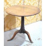 An 18th century oak side table with circular top and tripod base, 66cm diameter.