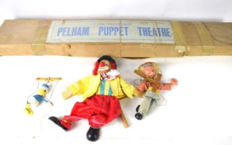 A vintage Pelham Puppet Theatre in the original box together with a Pelham Puppet, a clown puppet