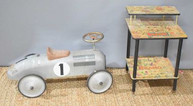 A vintage side table decoupaged with Beezer and Beano comics together with a metal child's racing