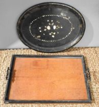 A Victorian black lacquered tray, inlaid with mother of pearl decoration, together with an oak