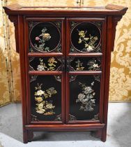 A 20th century Chinese cabinet, decorated with raised marble and agate floral displays, 82cm high.