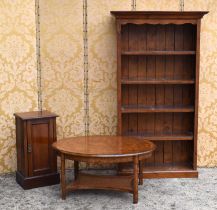 A pine bookcase with five shelves together with a John Lewis burr walnut coffee table and a mahogany