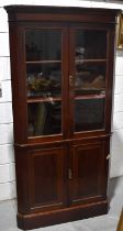 A modern mahogany corner cupboard, the top having glazed doors, 201cm by 98cm.