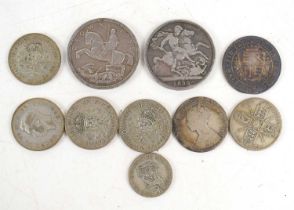 A group of silver coins to include a 1935 and 1890 crown, half crowns and others.