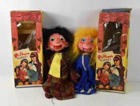 Two vintage Pelham Ventriloquial puppets, comprising a man with plaid shirt and a woman with