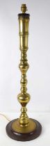 An impressive brass table lamp of baluster form, 85cm.