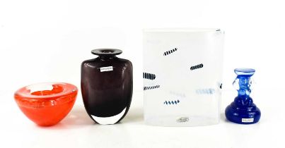 Four pieces of Kosta Boda glassware, to include a vase and tea light holder in orange, a figural