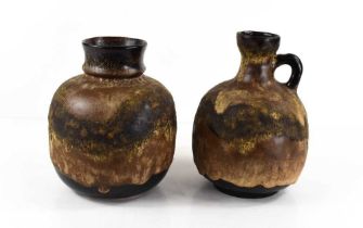 Two West German mid-century pottery vessels, with brown underglaze, the ewer measures 18cm high.