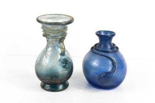 Two antique glass vases, one in pale blue with iridescent finish, together with a smaller example in