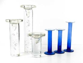 Two sets of Swedish glass candlesticks, a hand blown blue set of three graduated examples, with