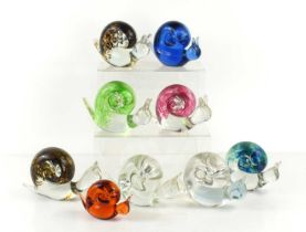 A group of nine Wedgwood, Kings Lynn glass snail paperweights, designed by Ronald Stennett-Wilson