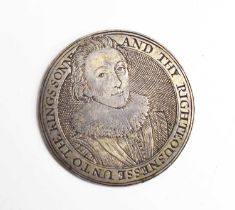 An engraved silver gaming counter depicting James I, facing bust wearing a ruff and a jewelled