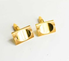 A pair of 9ct gold cufflinks, of rectangular modernist form with impressed oval, and having swivel