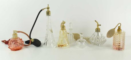 A collection of perfume atomisers and perfume bottles, including some Italian examples.