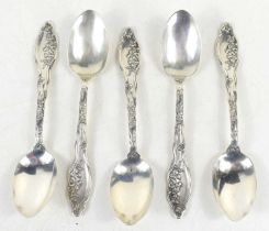 A set of five silver teaspoons, the handles decorated with floral sprays, 3.3toz.