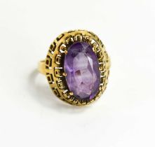 A large oval set amethyst ring, in raised pierced setting, the stone approximately 7.3 by12.9mm,