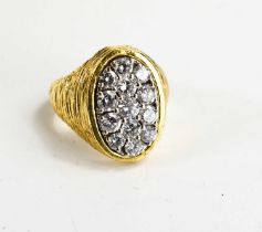 An 18ct gold and diamond Katchinsky gentleman's dress ring, the oval textured setting with