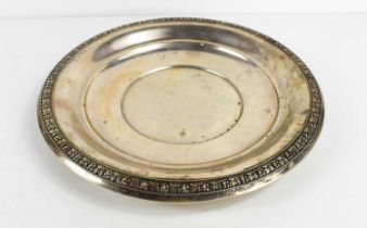 A silver dish, stamped Wallace Sterling to the base, the border relief decorated with flowers, 8.