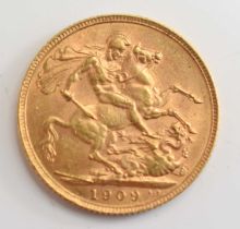 An Edward VII gold sovereign, dated 1909.