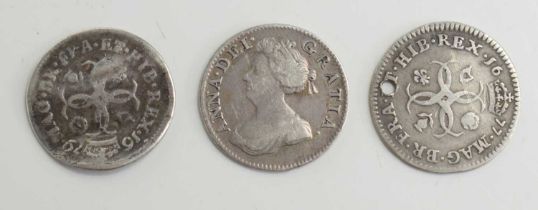Two Charles II silver groats together with a Queen Anne silver groat.