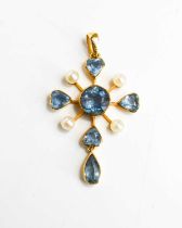 A pretty Edwardian pearl and topaz pendant, of quatrefoil form, the central rose cut topaz with