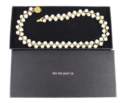 A pearl choker or collar, of lattice design, each pearl of non uniform shape, measuring