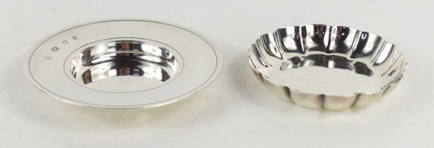 A silver pin dish with ring borders, 12cm diameter, hallmarked for London, 1973, 3.8toz, together