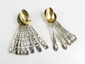 A set of six American silver teaspoons, the shaped handles having embossed floral decoration,