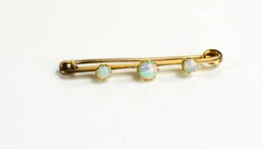 A Victorian 15ct gold and opal three stone bar brooch, 2.5g, 4cm long.