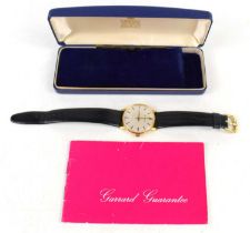 A Gentleman's gold plated manual wind, wristwatch, by Garrard, in its original box with papers.
