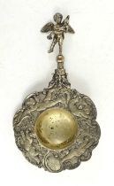A continental silver tea strainer, likely Dutch, the strainer decorated with cherubs amongst