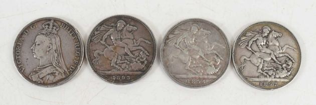 Four Queen Victoria silver crowns dated 1893, 1897, 1894 and 1889.