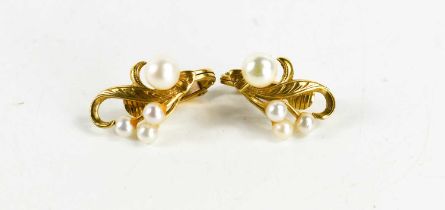 A pair of 9ct gold and pearl earrings, of foliate form, engraved with decoration, 4.46g.