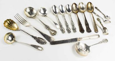 A group of silver cutlery, to include three silver teaspoons with decorative handles and engraved