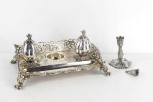 A fine 19th century silver desk stand with a pierced shaped gallery standing on scrolling feet