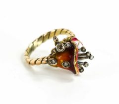 A gold, enamel and diamond ring in the form of a lily, enamelled in red and white, the stamen