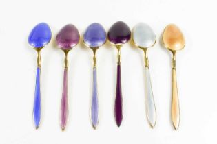 A set of six David Andersen silver gilt and enamel teaspoons. the spoons each with a different