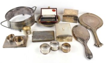 A group of silver and silver plated items comprising two silver covered cigarette boxes, six