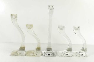 Five clear glass 'Connect' candlesticks, the tallest measures 25cm high.