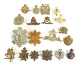 A group of regimental cap badges to include Tyneside Scottish, Royal Engineers, North Stafford,