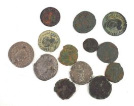 A small group of Roman coins to include Licinius, Postumus and others,