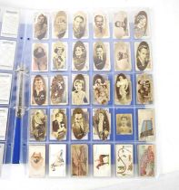 Two albums of cigarette cards to include Carreras film stars, Pinnace footballers, John Player Army,