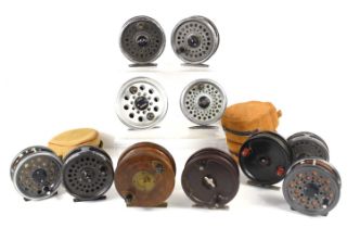 A group of fly fishing reels including a wooden example, a bakelite Allcock reel, a Milbro reel