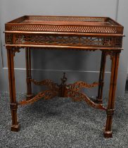 A mahogany fret work carved Chippendale side table.
