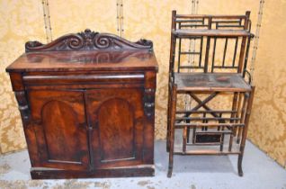A Victorian mahogany sideboard having a carved shaped back together with a Victorian bamboo